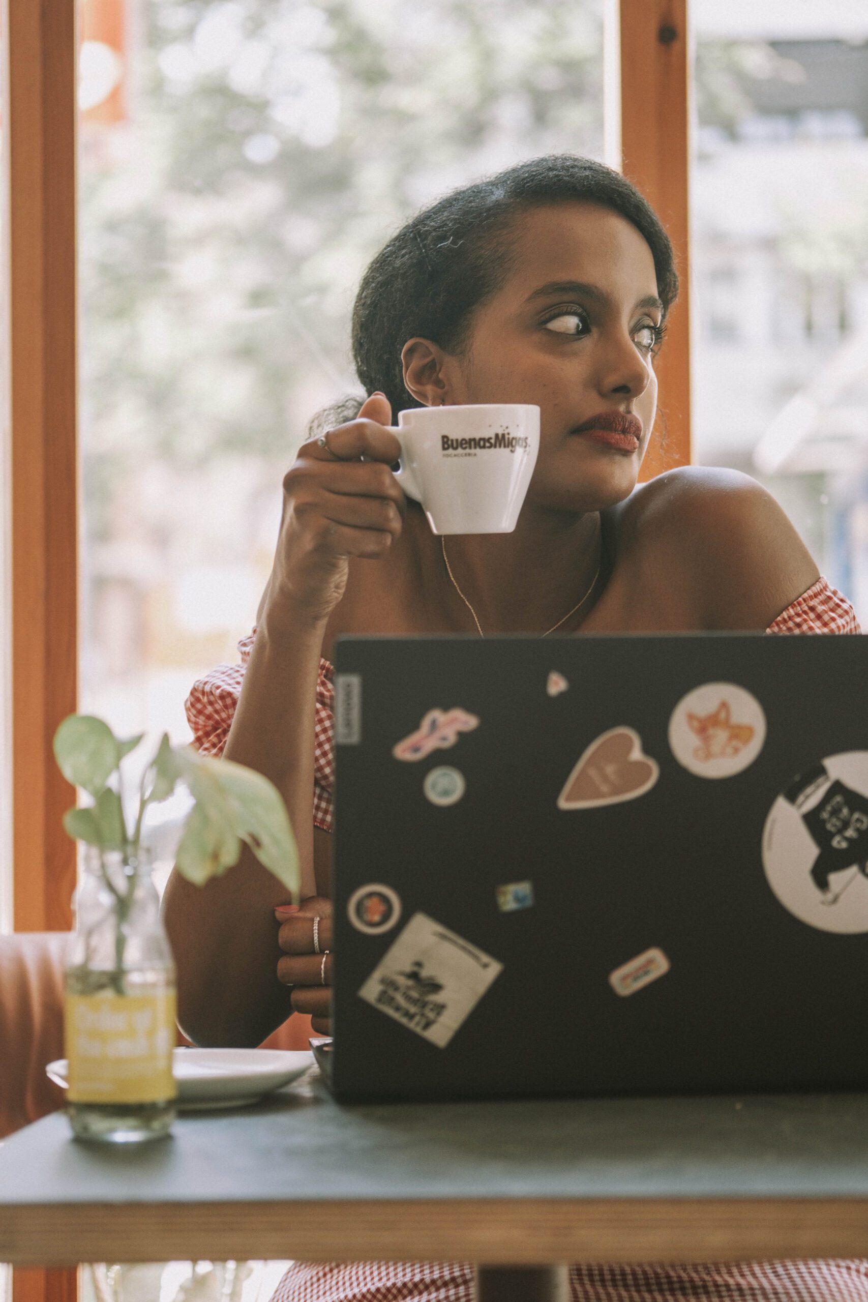 Woman remote worker and solo traveler enjoying flexibility of digital nomad life