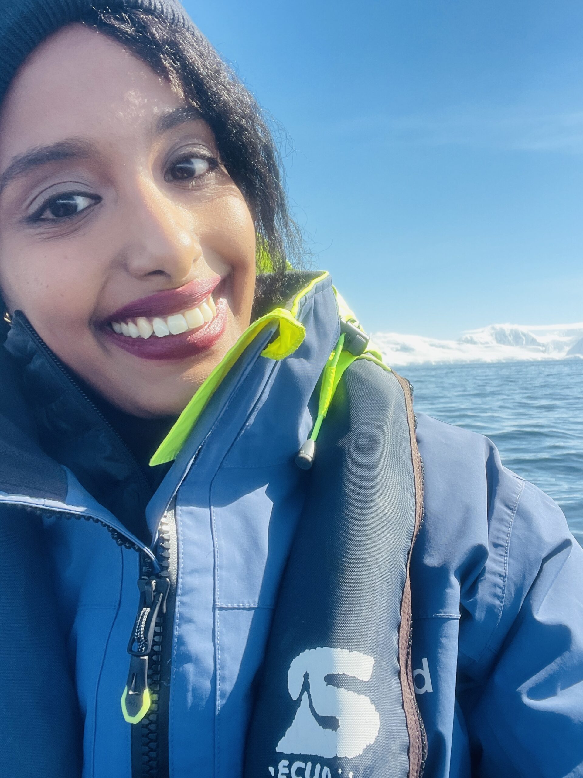 Solo female Arctic traveler on a Zodiac boat tour in Antarctica
