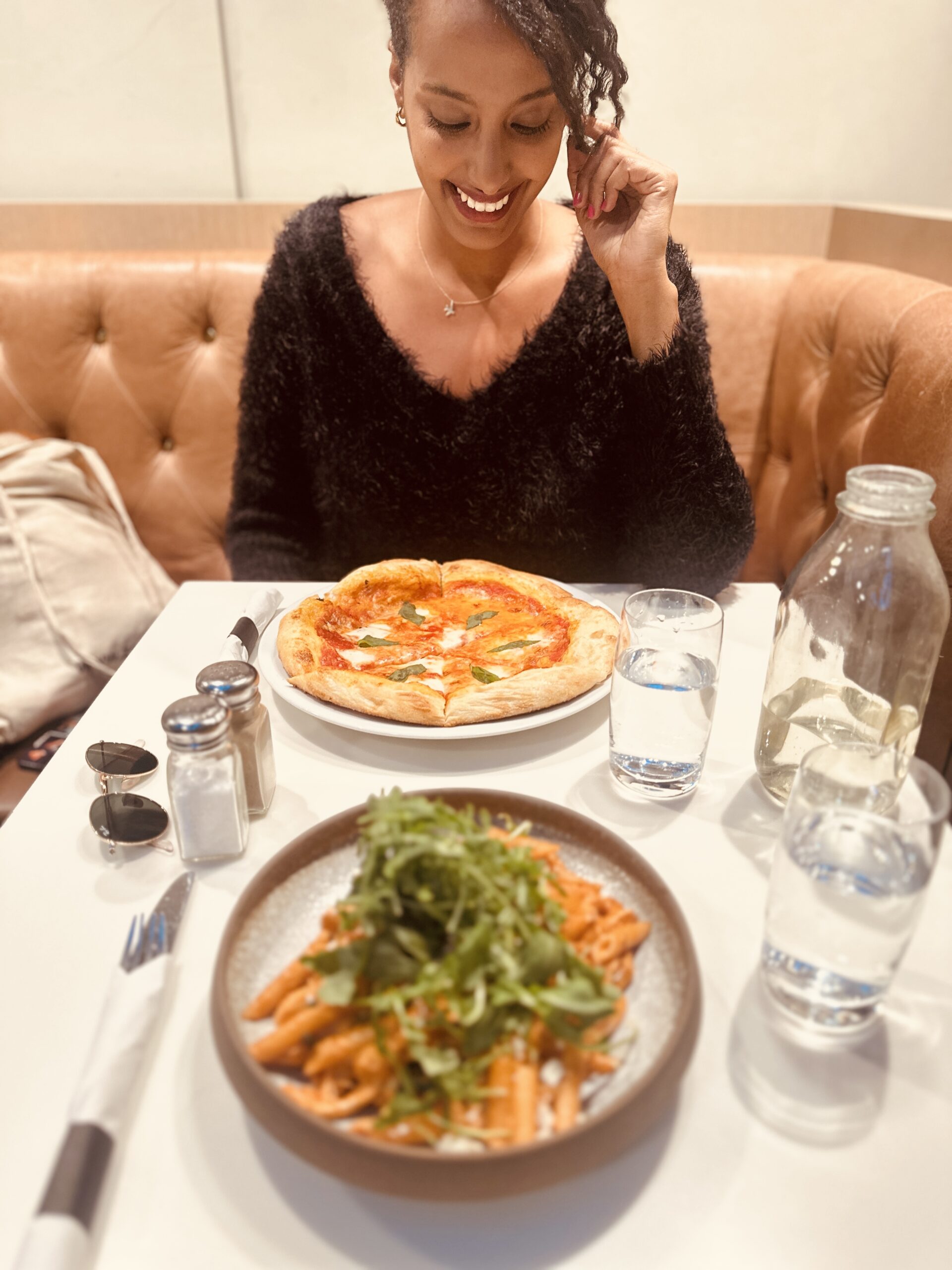 "Solo female traveler tasting local cuisine while traveling in Canada
