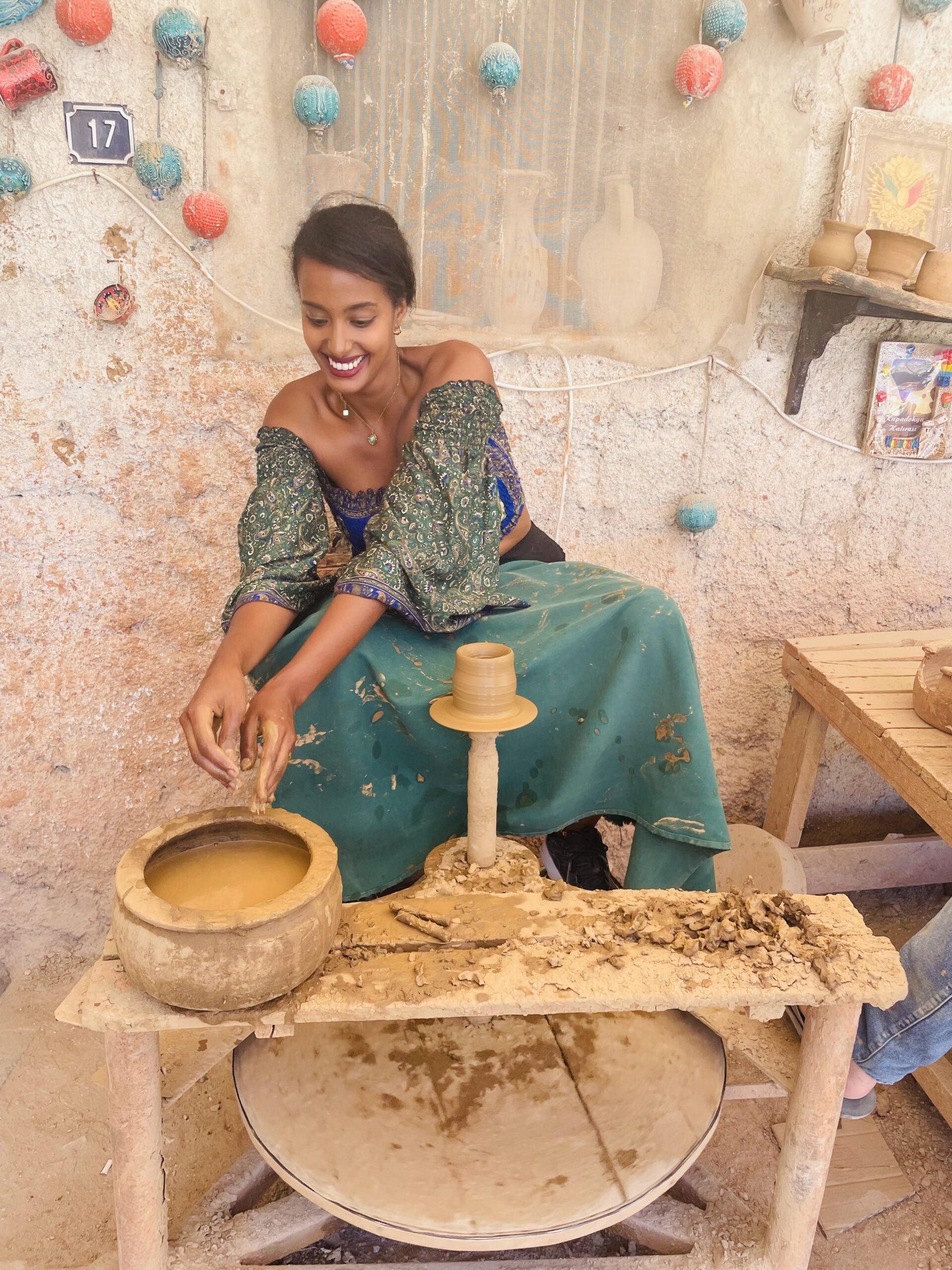 Solo female traveler learning ceramics during a pottery course in Turkey