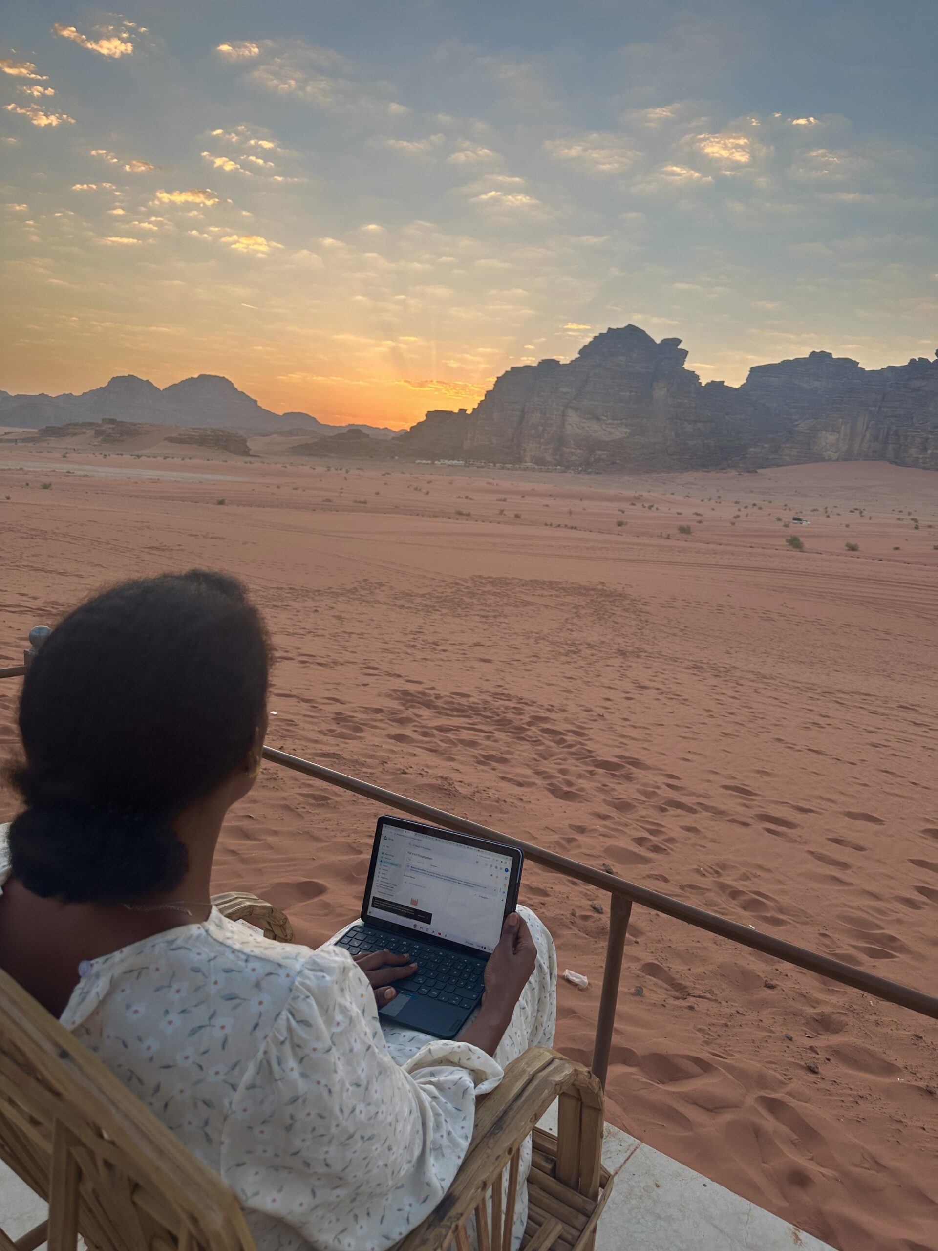 Solo female traveler enjoying a sunset adventure in the Jordan desert"