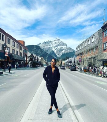 Solo female traveler exploring scenic landscapes in Canada