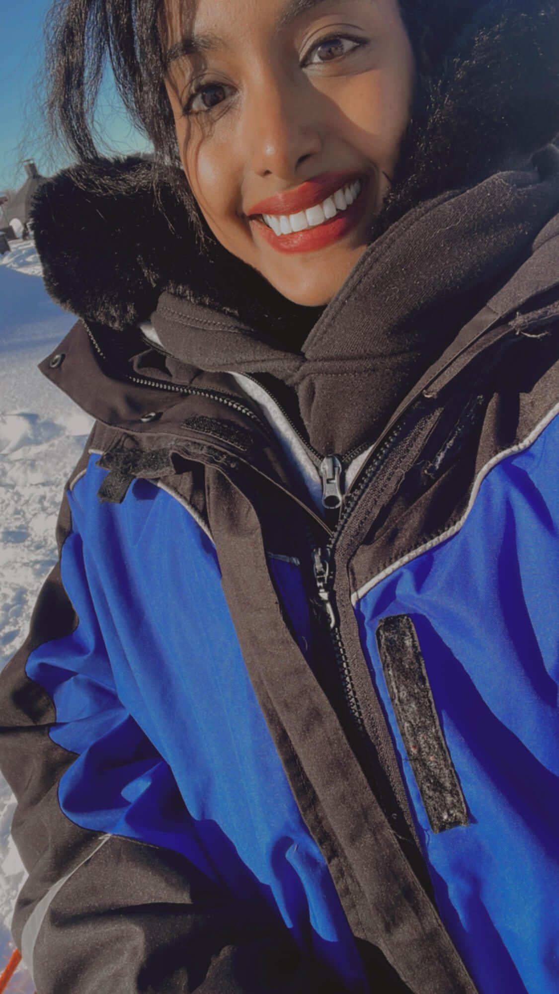 Solo traveler exploring snow-covered mountains in Norway