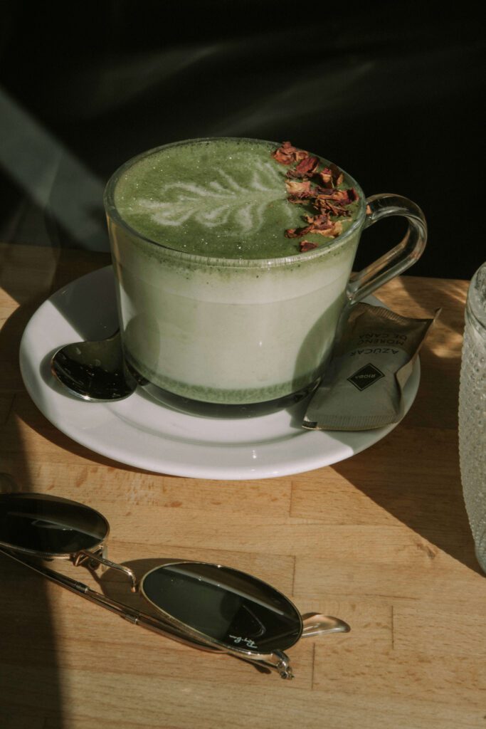 Matcha latte as a healthy coffee alternative for solo female travelers practicing self-care tips while traveling alone.