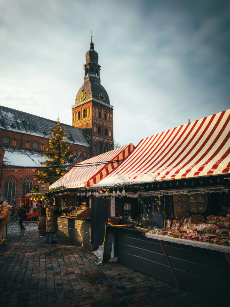 Charming Christmas market square glowing with fairy lights for solo female winter traveling