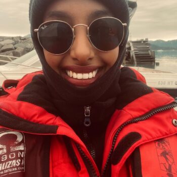 Solo female traveler exploring the icy landscapes of Greenland