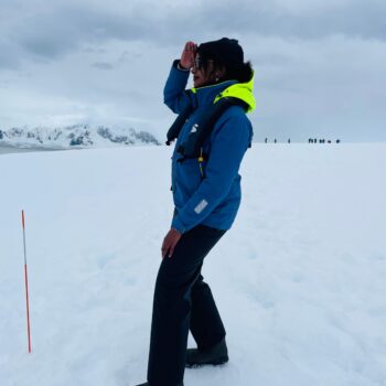 Solo female traveler exploring Antarctica on a guided expedition