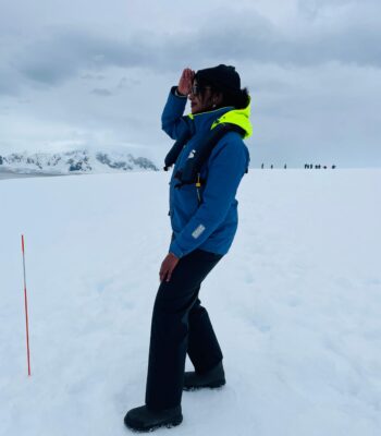 Solo female traveler exploring Antarctica on a guided expedition