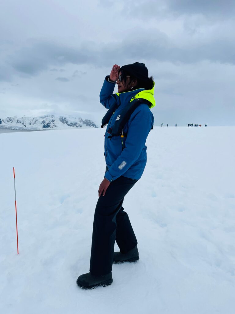 Solo female traveler exploring Antarctica on a guided expedition