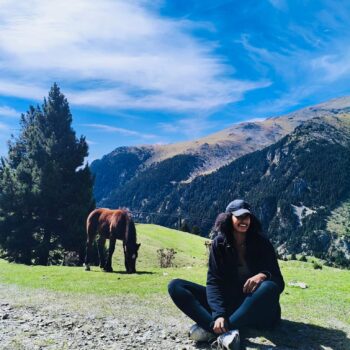 Solo female traveler hiking in Spain mountains, featured on a solo female blog about travel safety and tips