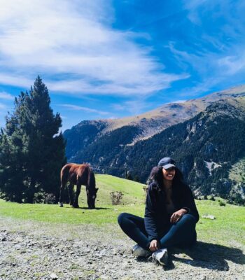 Solo female traveler hiking in Spain mountains, featured on a solo female blog about travel safety and tips