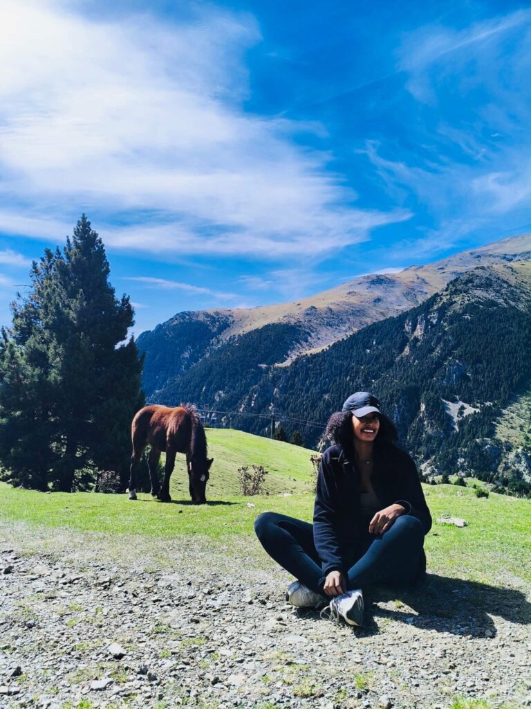 Solo female traveler hiking in Spain mountains, featured on a solo female blog about travel safety and tips