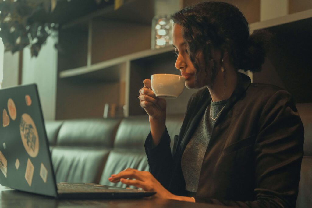 Solo female traveler working remotely from café in Barcelona