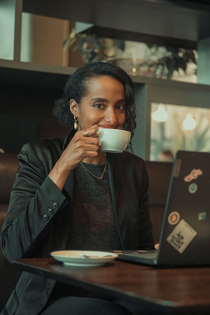 Solo female traveler working remotely from café in Barcelona