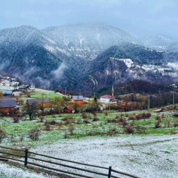 Solo female traveler exploring Peja in Kosovo with dramatic mountain cliffs
