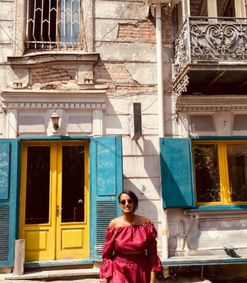 Solo female traveler walking through Old Town Tbilisi in Georgia