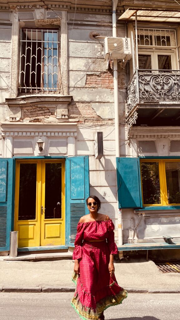 Solo female traveler walking through Old Town Tbilisi in Georgia