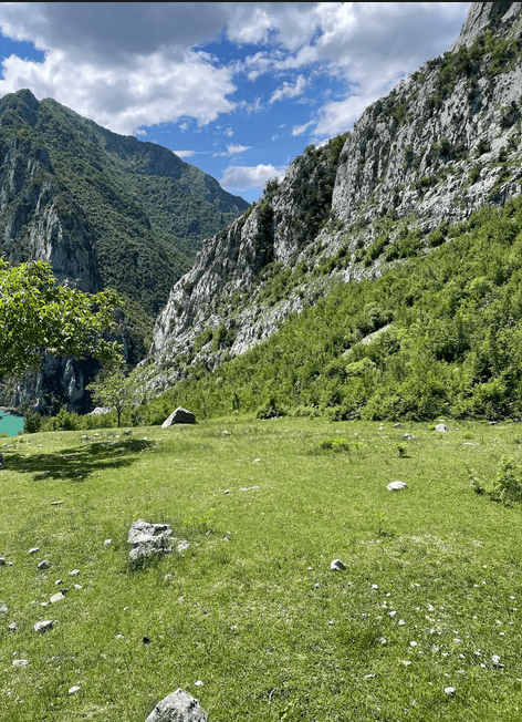 Solo female traveler hiking the famous Valbona Pass trail in northern Albania