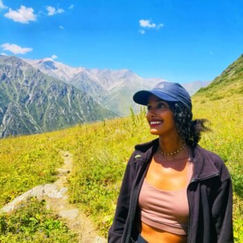 Solo female traveler hiking in the mountains of Kyrgyzstan
