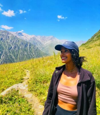 Solo female traveler hiking in the mountains of Kyrgyzstan