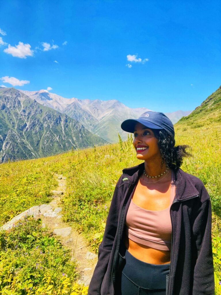 Solo female traveler hiking in the mountains of Kyrgyzstan
