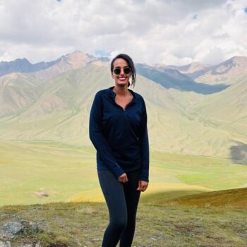 Solo female traveler hiking in the mountains of Kyrgyzstan