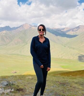 Solo female traveler hiking in the mountains of Kyrgyzstan