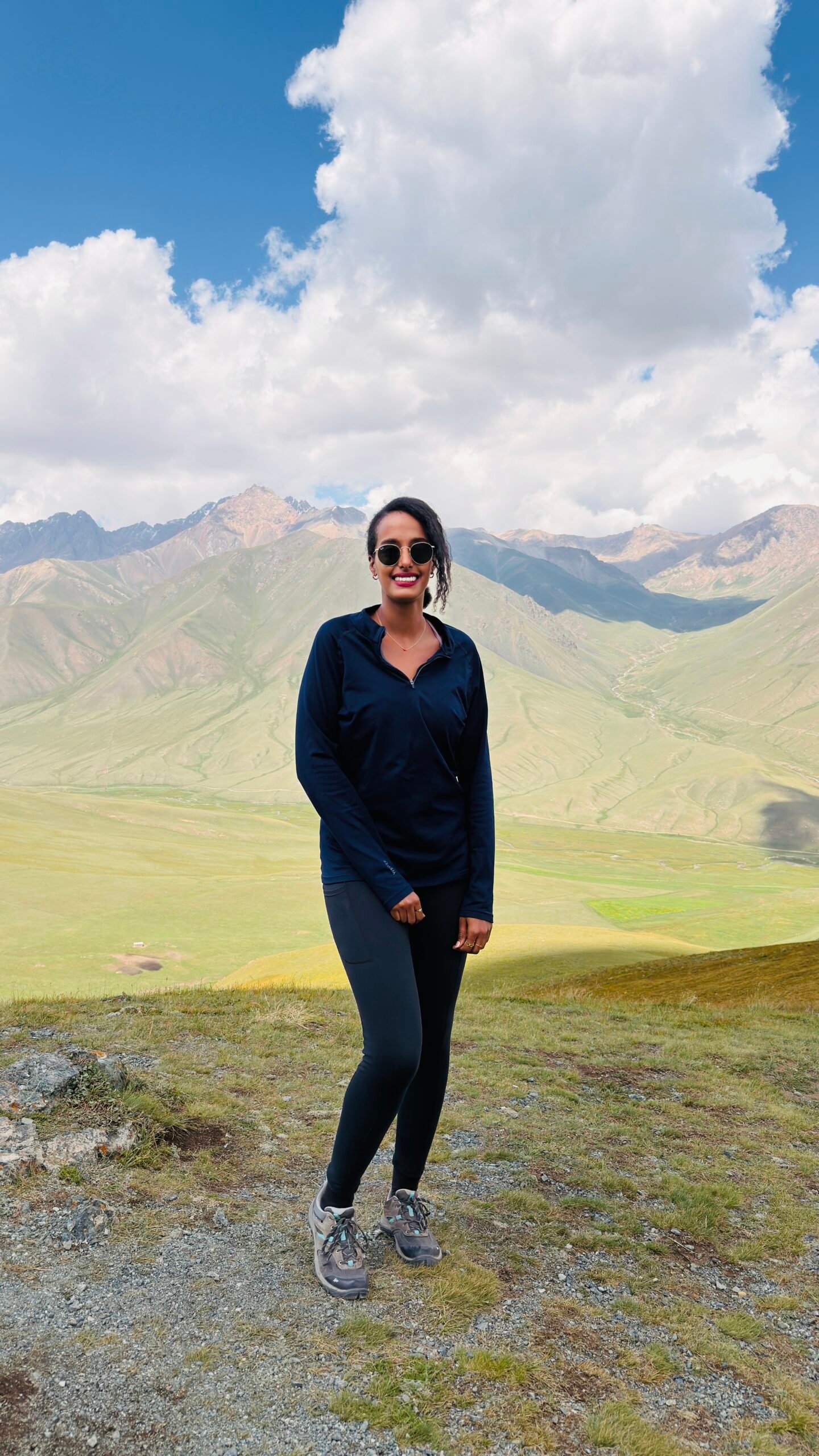 Solo female traveler hiking in the mountains of Kyrgyzstan
