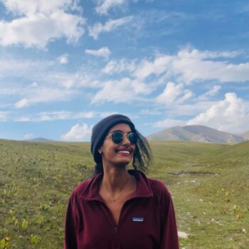 Solo female traveler at Song-Kul Lake in Kyrgyzstan