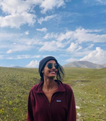 Solo female traveler at Song-Kul Lake in Kyrgyzstan