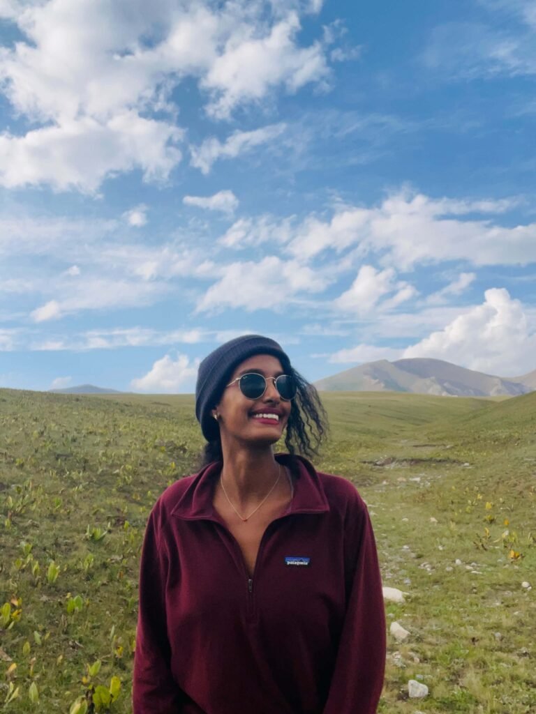 Solo female traveler at Song-Kul Lake in Kyrgyzstan