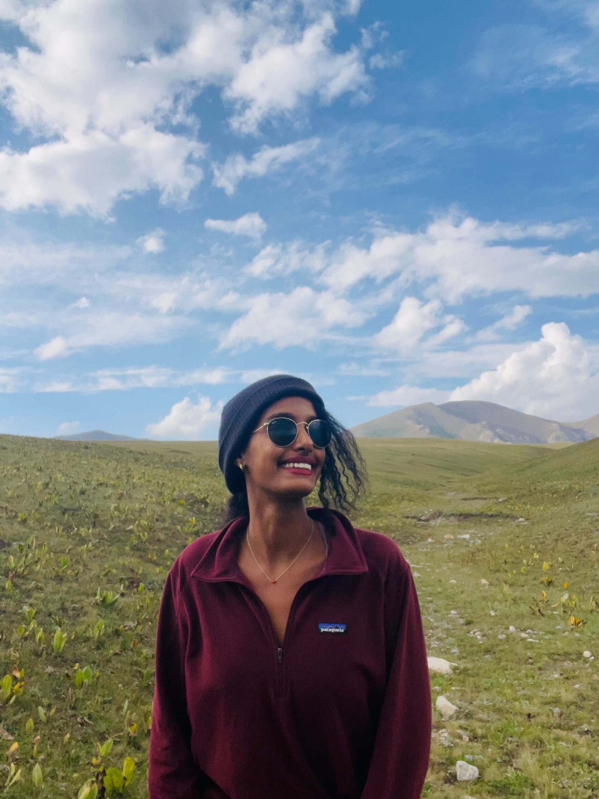 Solo female traveler at Song-Kul Lake in Kyrgyzstan