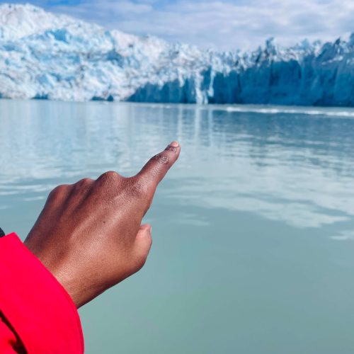 Female traveler exploring Antarctic landscapes alone