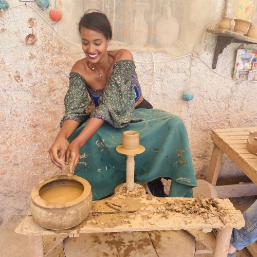 Solo female traveler learning ceramics during a pottery course in Turkey