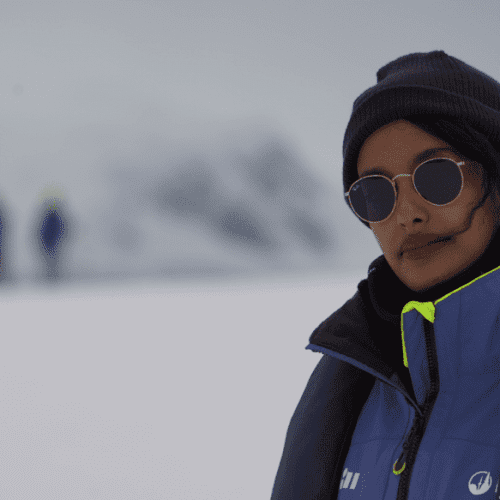 Female traveler exploring Antarctic landscapes alone