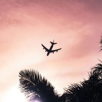 Flying into sunset – empowering airplane view for women traveling solo