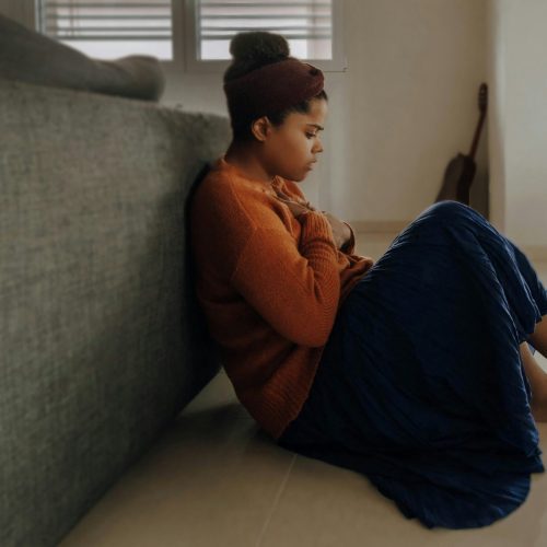 A woman feeling anxious or afraid of traveling alone