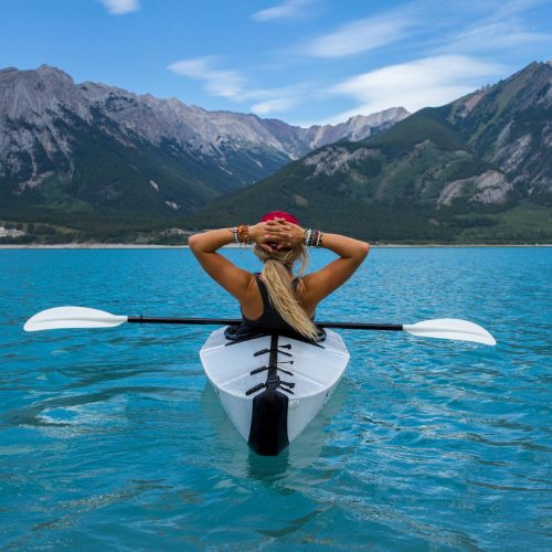 Solo female traveler on a kayaking adventure in Canada’s lakes and rivers