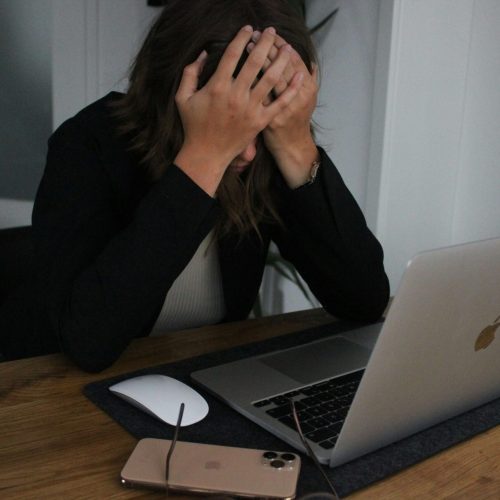 solo female remote worker using laptop while traveling abroad